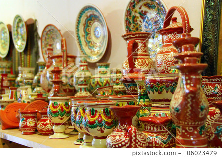 earthenware on the shelves of shop 106023479