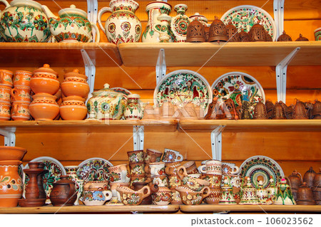 earthenware on the shelves of shop 106023562