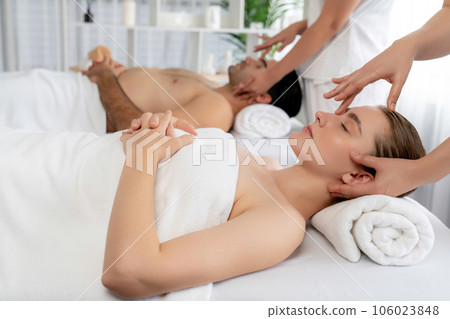 Caucasian couple enjoying relaxing anti-stress head massage. Quiescent Caucasian couple enjoying relaxing anti-stress head massage. Quiescent 106023848