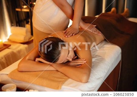Caucasian woman customer enjoying relaxing anti-stress massage. Quiescent Caucasian woman customer enjoying relaxing anti-stress massage. Quiescent 106023850