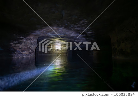 Kayaking a abandoned silica mine that is flooded with water. Kayaking a abandoned silica mine that is flooded with water. 106025854