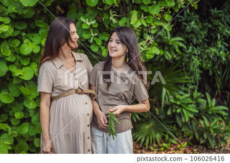 A heartwarming moment captured in the park as a pregnant woman after 40 shares a special bond with her teenage daughter, embracing the beauty of mother-daughter connection A heartwarming moment captured in the park as a pregnant woman after 40 shares a special bond with her teenage daughter, embracing the beauty of mother-daughter connection 106026416
