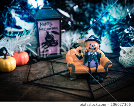 Frankenstein with blur pumpkin on wooden with dark black Background,Halloween concept. Frankenstein with blur pumpkin on wooden with dark black Background,Halloween concept. 106027306