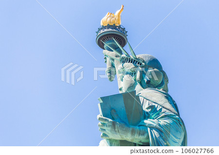 Close view of the Statue of Liberty over blue sky Close view of the Statue of Liberty over blue sky 106027766