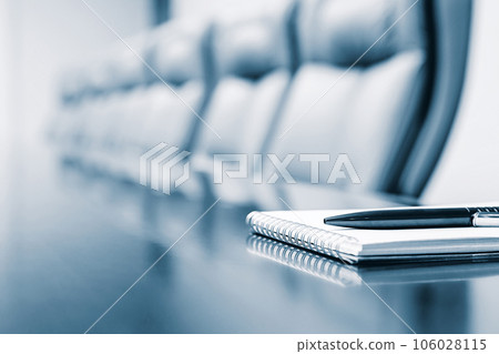 Closeup of notepad kept on table in empty room Closeup of notepad kept on table in empty room 106028115