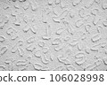Grunge background of uneven exterior wall with white paint 106028998