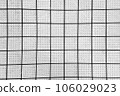 Grunge background of white square tiles 106029023