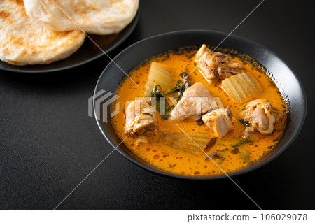 Chicken curry soup with roti Chicken curry soup with roti 106029078