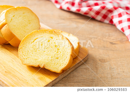 potatoes bread sliced on wood board 106029383