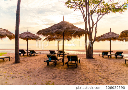 Umbrella and chair around swimming pool in resort hotel for leisure travel and vacation neary sea ocean beach Umbrella and chair around swimming pool in resort hotel for leisure travel and vacation neary sea ocean beach 106029390