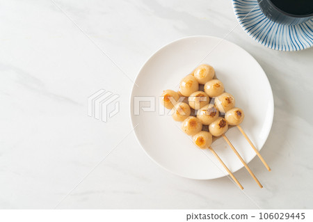 Mitarashi dango. Dumpling in a sweet soy sauce 106029445