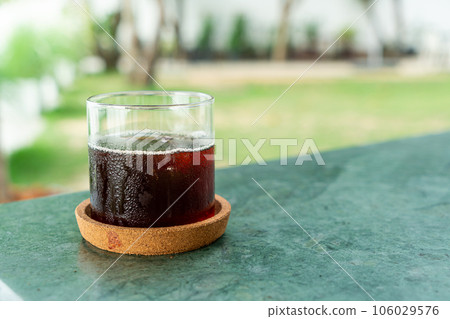 iced americano coffee glass on table iced americano coffee glass on table 106029576