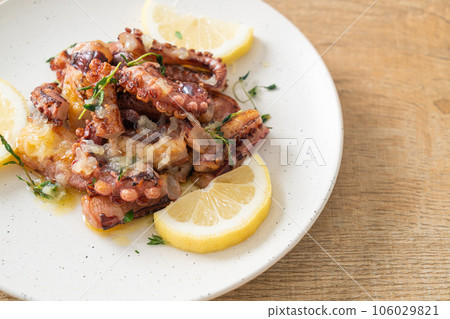 grilled octopus or squid with butter lemon sauce grilled octopus or squid with butter lemon sauce 106029821