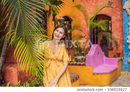 A strong and resilient woman over 40 embraces the beauty of childbirth in Mexico, celebrating the journey of motherhood with cultural richness 106029827