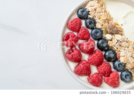 homemade yogurt bowl with raspberry, blueberry and granola 106029835