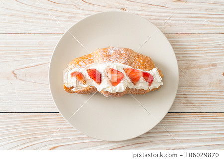 strawberry fresh cream croissant on plate 106029870