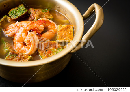 Sour soup made of Tamarind Paste with Shrimps and Vegetable Omelet Sour soup made of Tamarind Paste with Shrimps and Vegetable Omelet 106029921