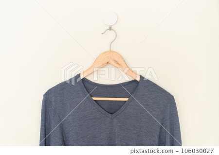 woman t-shirt hanging on wall woman t-shirt hanging on wall 106030027