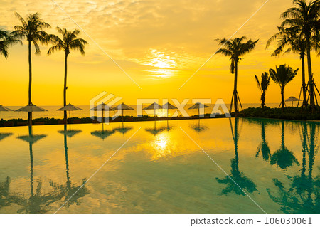 umbrella with bed pool around swimming pool with ocean sea background umbrella with bed pool around swimming pool with ocean sea background 106030061