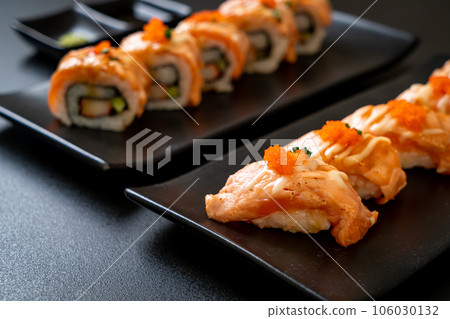 grilled salmon sushi on black plate grilled salmon sushi on black plate 106030132