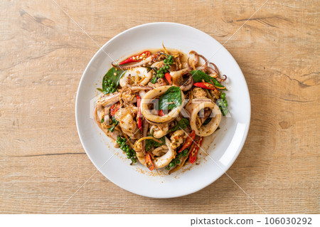 stir fried holy basil with octopus or squid and herb 106030292