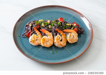 stir-fried black spaghetti with garlic and shrimps stir-fried black spaghetti with garlic and shrimps 106030380
