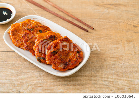 Korean Kimchi pancake or Kimchijeon - Fried Mixed Egg, Kimchi, and Flour 106030643