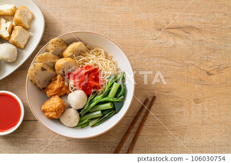 egg noodles with fish balls and shrimp balls in pink sauce, Yen Ta Four or Yen Ta Fo 106030754