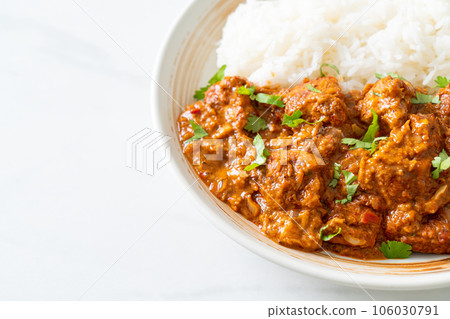 chicken tikka masala with rice on plate 106030791