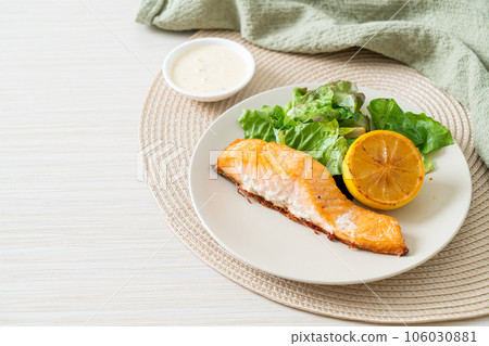 fried salmon steak with lemon and vegetable fried salmon steak with lemon and vegetable 106030881