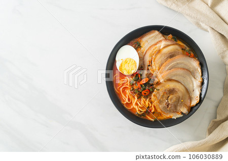 Ramen Noodles Spicy Tomyum Soup with Roast Pork Ramen Noodles Spicy Tomyum Soup with Roast Pork 106030889