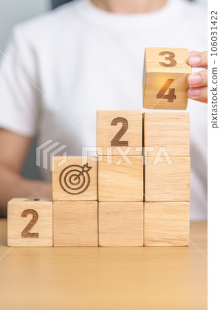 2024 wood block dartboard sign with Building. business goal, success, strategy, target, mission, action, growth, teamwork, plan, idea and New Year start concept 2024 wood block dartboard sign with Building. business goal, success, strategy, target, mission, action, growth, teamwork, plan, idea and New Year start concept 106031422