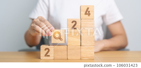 hand holding 2024 block with magnifying glass icon. SEO, Search Engine Optimization, hiring , Advertising, Idea, Strategy, marketing, Keyword, Content and New Year start concepts hand holding 2024 block with magnifying glass icon. SEO, Search Engine Optimization, hiring , Advertising, Idea, Strategy, marketing, Keyword, Content and New Year start concepts 106031423