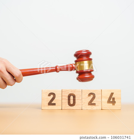 2024 block with judge gavel on table. Law, lawyer, judgment, justice auction and bidding concept 106031741