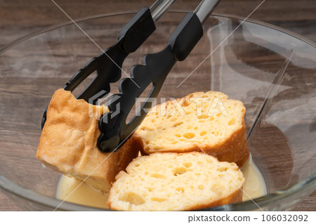French toast dipped in egg mixture French toast dipped in egg mixture 106032092
