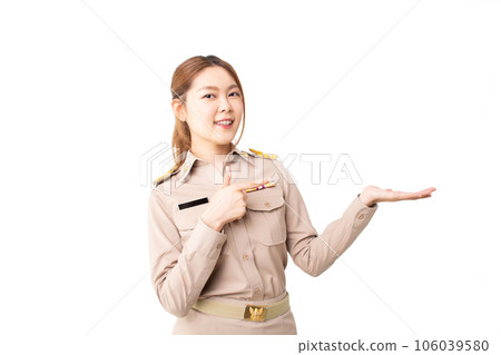 Female Thai government officer in khaki uniforms showing empty copy space for product, text or message on over isolated white background. Concept of advertising, product, sale promotion, presentation. Female Thai government officer in khaki uniforms showing empty copy space for product, text or message on over isolated white background. Concept of advertising, product, sale promotion, presentation. 106039580