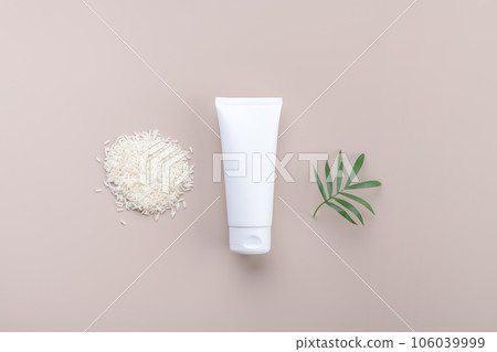 White squeeze bottle plastic tube mockup for medicine or cosmetics with white rice on beige background 106039999