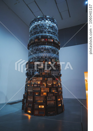 Illuminated Babel at Tate Modern Museum. Analogue radios stacked in layers at Art Gallery. Sculptural installation in exhibition centre of London. Illuminated Babel at Tate Modern Museum. Analogue radios stacked in layers at Art Gallery. Sculptural installation in exhibition centre of London. 106040187