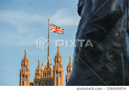 Single Union Jack flag waving in front of Big Ben at the Houses of Parliament in London, UK on a clear sunny day 106040654