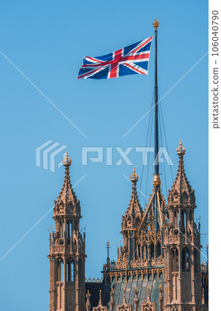 Single Union Jack flag waving in front of Big Ben at the Houses of Parliament in London, UK on a clear sunny day Single Union Jack flag waving in front of Big Ben at the Houses of Parliament in London, UK on a clear sunny day 106040790