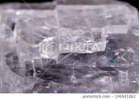 Macro mineral stone Iceland spar on black background Macro mineral stone Iceland spar on black background 106041862