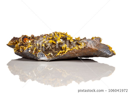 Macro mineral stone yellow Wulfenite on a white background Macro mineral stone yellow Wulfenite on a white background 106041972