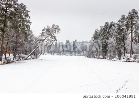 Winter lake covered with ice and snow Winter lake covered with ice and snow 106041991