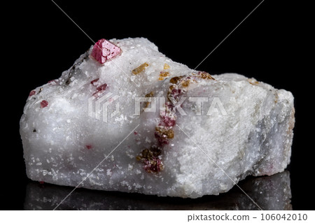 Macro mineral stone Spinel on a black background Macro mineral stone Spinel on a black background 106042010