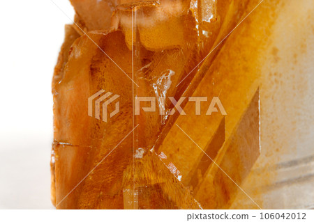 Macro mineral stone Calcite on a white background 106042012