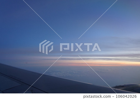 The view from the window of an airplane in the evening The view from the window of an airplane in the evening 106042026