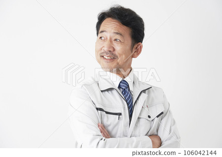 Portrait of a smiling middle-aged worker White background 106042144
