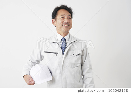 Portrait of a smiling middle-aged worker White background 106042158