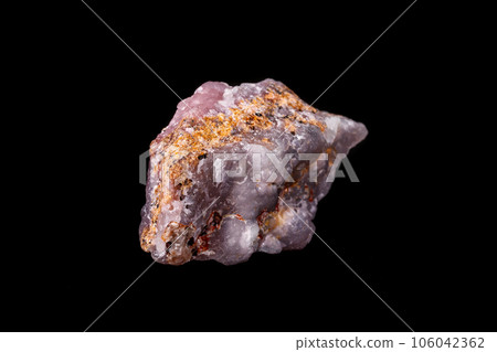 Macro pink Smithsonite mineral stone on microcline on black background Macro pink Smithsonite mineral stone on microcline on black background 106042362