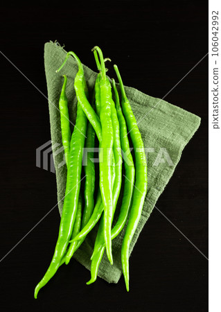 chili pepper on a black background. 106042992